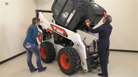 how to raise the cab on a bobcat skid steer|free skid steer training materials.